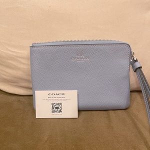 Beautiful, new sky/periwinkle blue Coach wristlet.